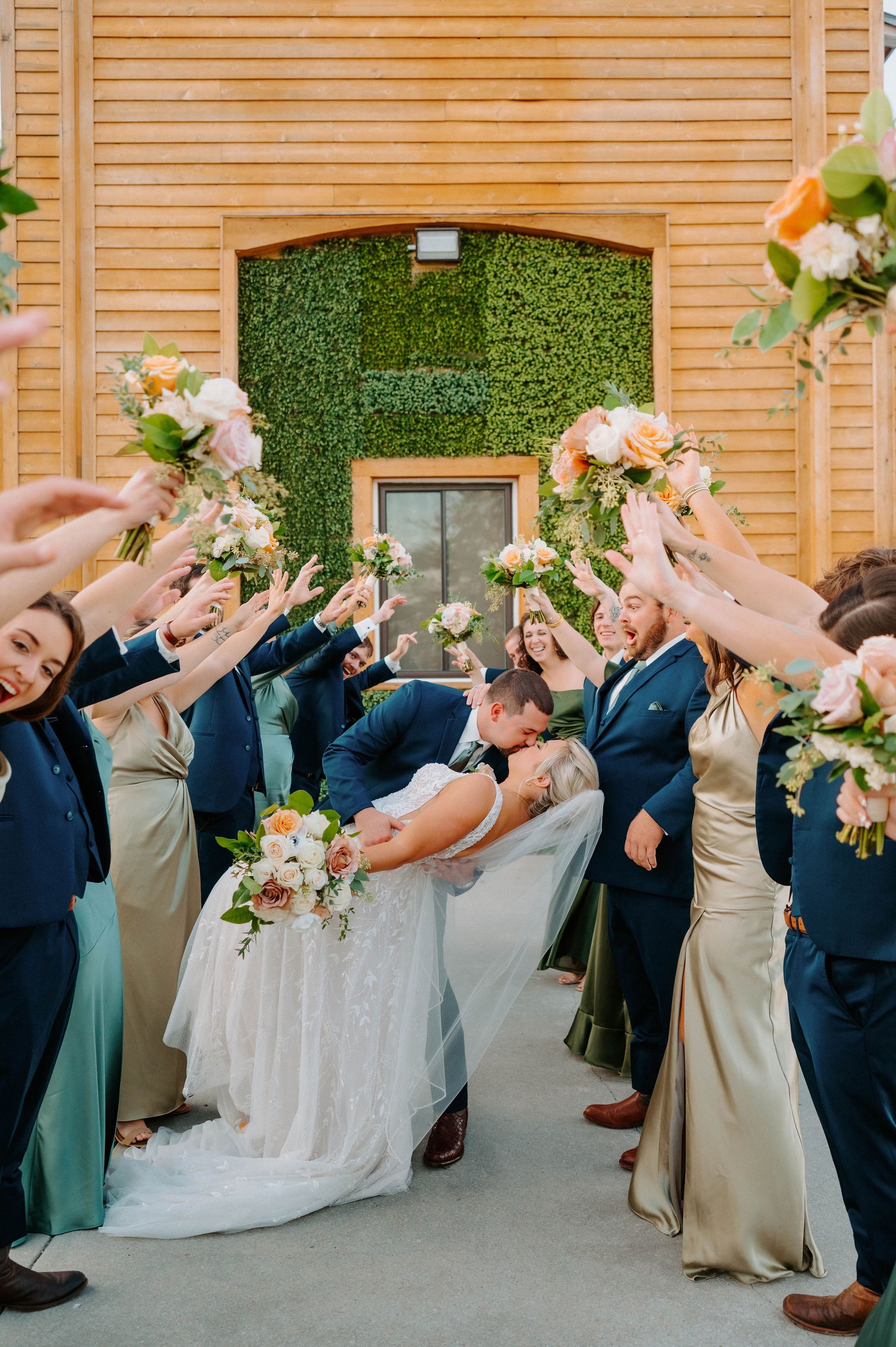 wedding kiss the bride photo, floral design by Wendy Paramore