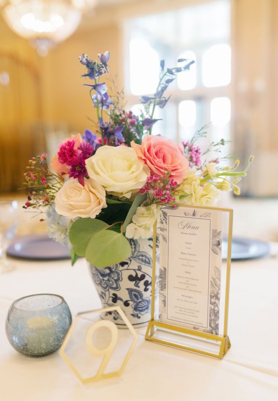 Vase of flowers as table centerpiece with coral, white and pink roses, floral design by Wendy Paramore