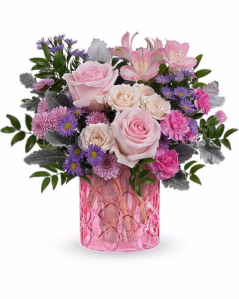 
DESCRIPTION
VASE
SIZES
Celebrate Mom with the Haute Pink Bouquet, a graceful mix of pink and lavender blooms beautifully arranged in the Pink Rhapsody Vase. This thoughtful Mother's Day surprise adds soft color and cheerful charm to her home.

The Pink Haze Bouquet is a beautiful Mother's Day floral arrangement featuring pink roses, crème spray roses, pink alstroemeria, miniature hot pink carnations, lavender button spray chrysanthemums, and large purple monte cassino asters, accented with dusty miller and huckleberry, delivered in the Pink Rhapsody Vase.